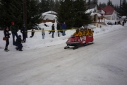 Safety first! Fan favorite; the firefighter sled honking its way down the course