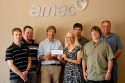 Kathy Moore of WKFOR recives a cheque for $1,873.17 from Dean Corkill and the Mechanical Department at AMEC.
