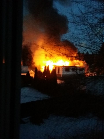 Garage burns down, home saved after early morning fire