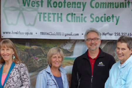 Big smiles from West Kootenay Community TEETH after winning $50,000 from Pacific Blue Cross