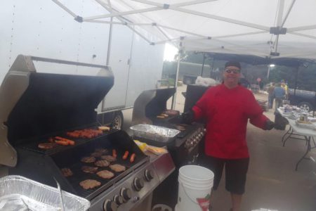 Community BBQ for Grand Forks this afternoon, Castlegar man cooking the cuts