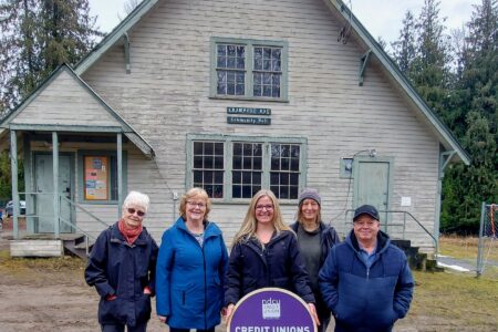 Local credit union makes a significant donation to the restoration of the community hall in Crawford Bay.
